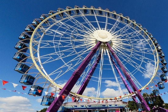 Ferris wheel against blue sky.